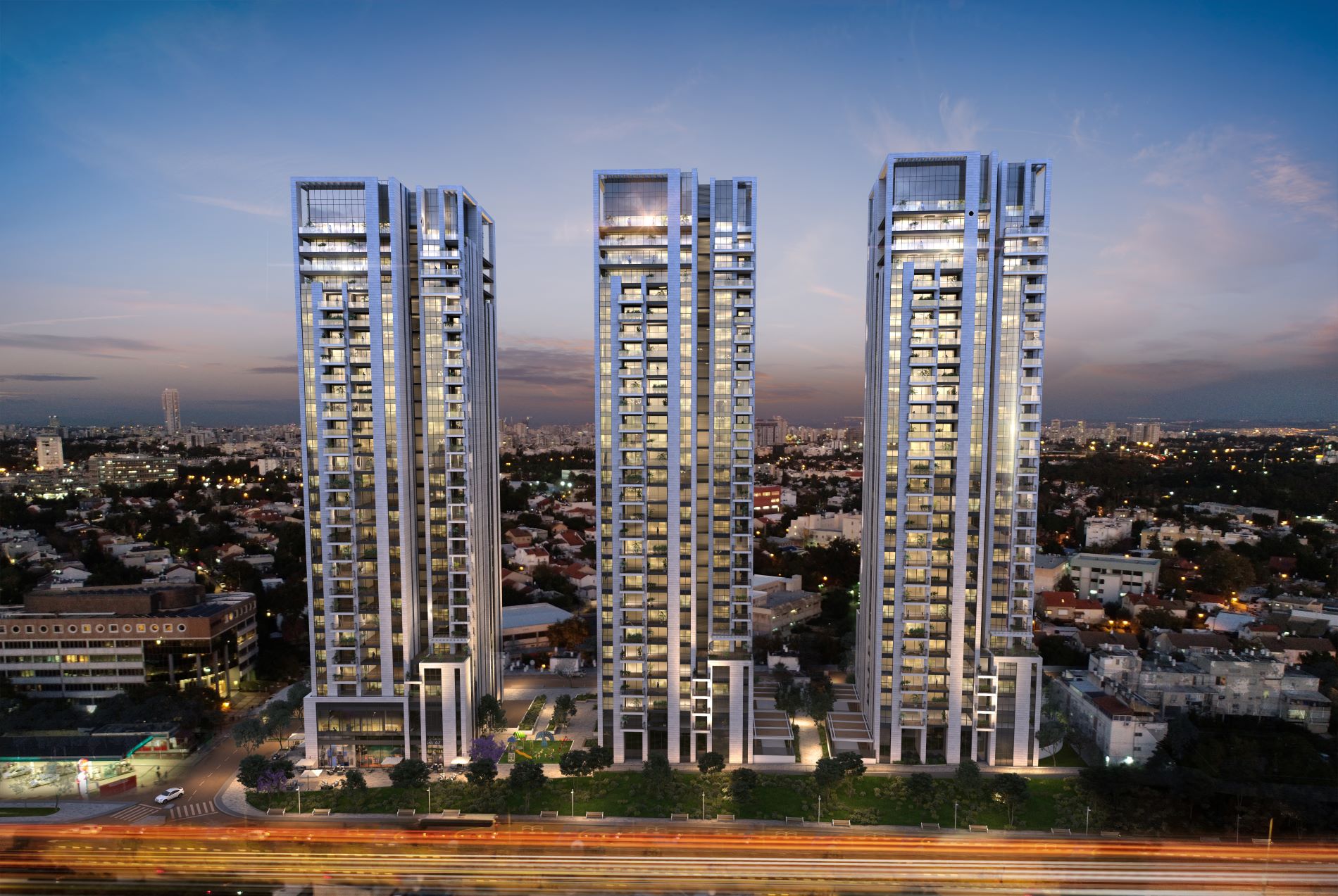פרוייקט אאורה רמת חן החדשה ברמת גן - 3 בנייני מגורים רבי-קומות בתאורת לילה.